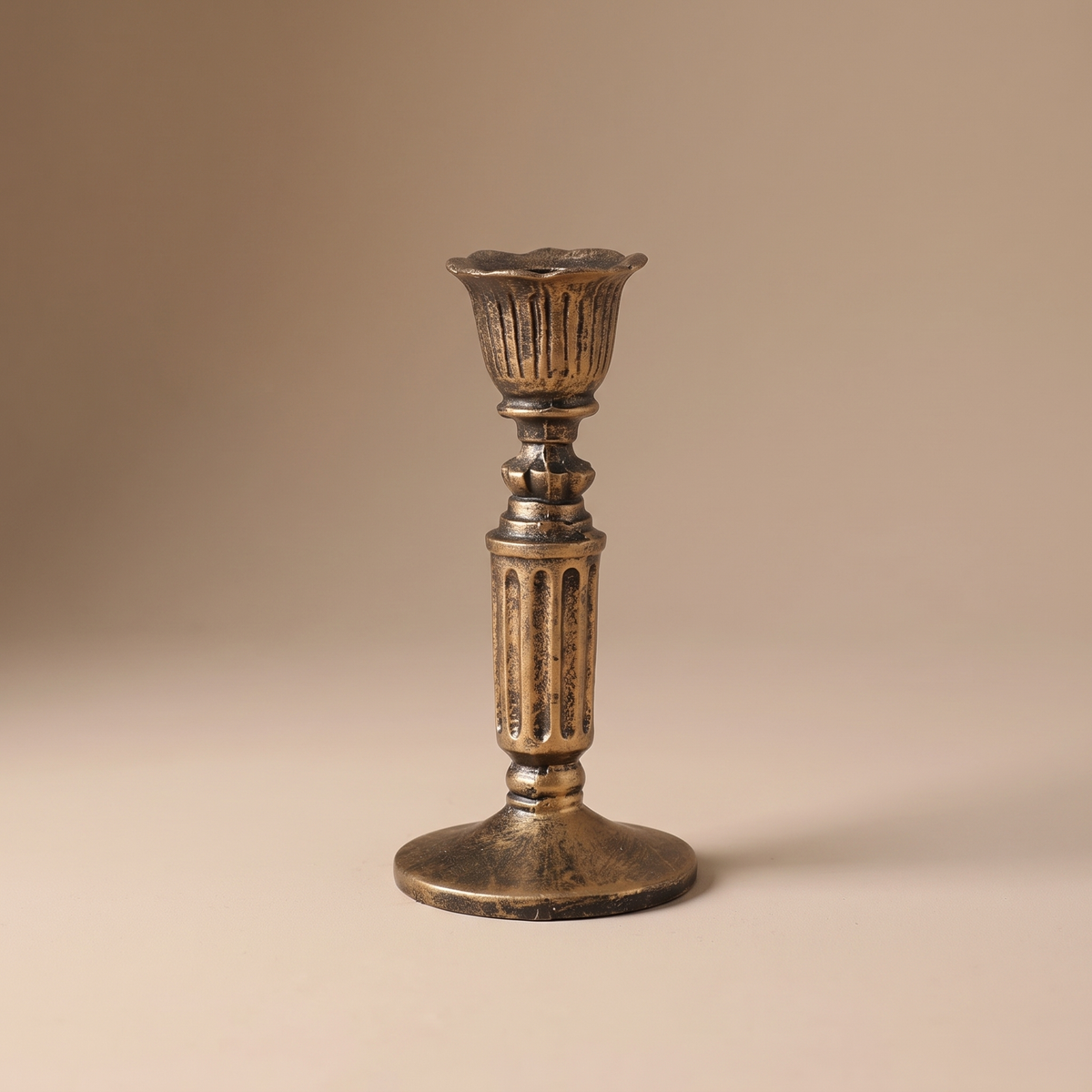 Vintage taper candle holder in antiqued bronze, styled as a mantel and dining-table centerpiece accent