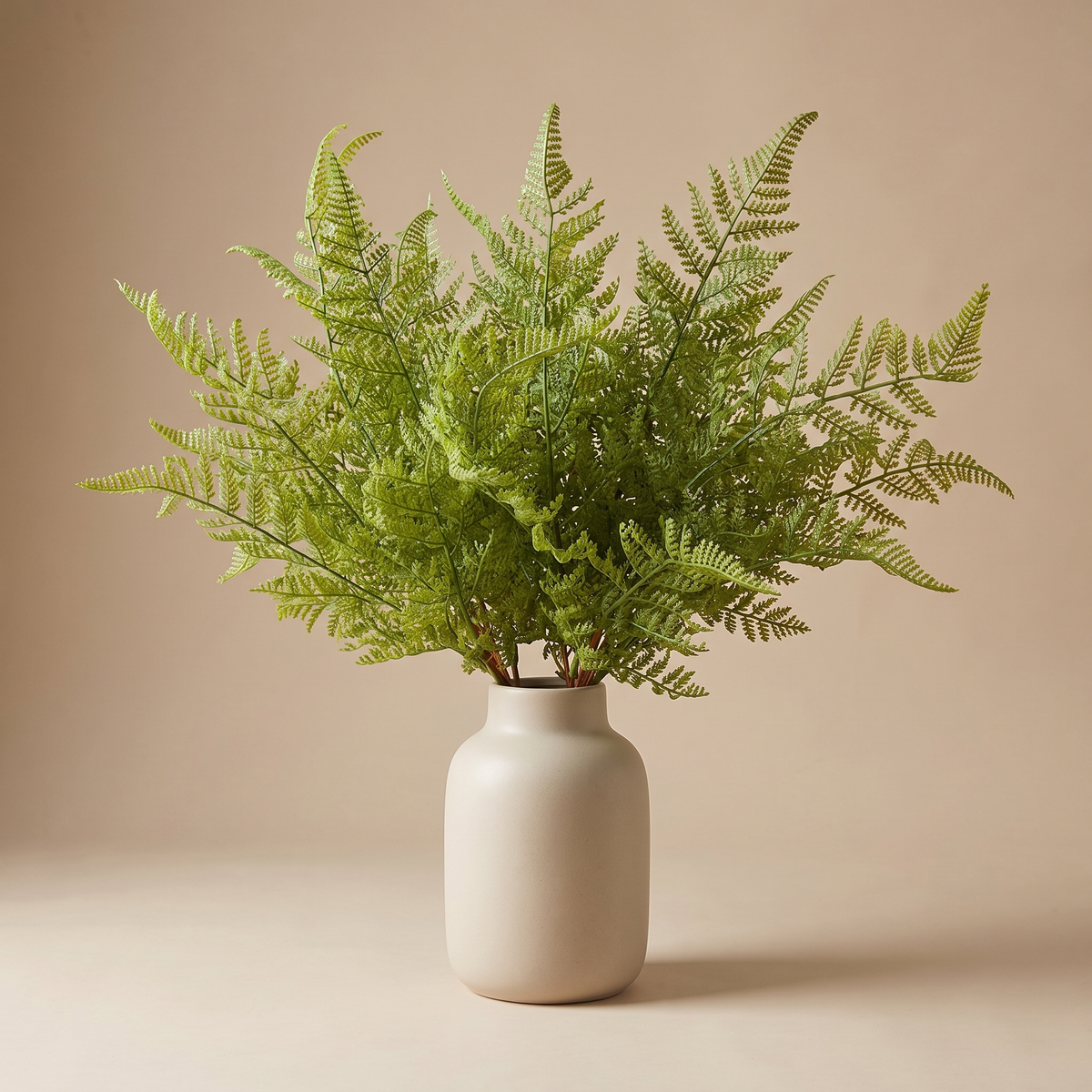 Real-touch faux fern bunch in a slim ceramic vase, dusted and styled to look like a living plant