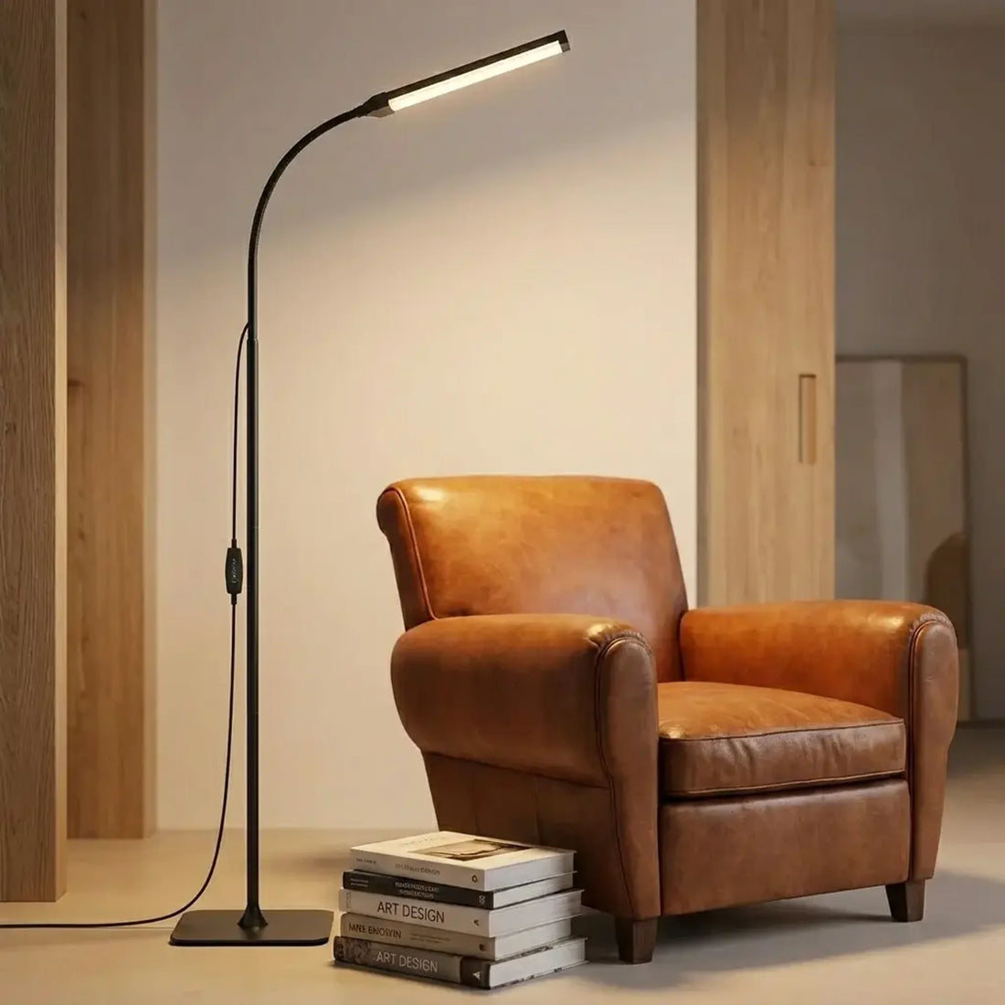 LED gooseneck floor lamp with dimmable reading light positioned beside a reading chair