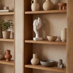Black resin face figurine on a wooden desk in a home office
