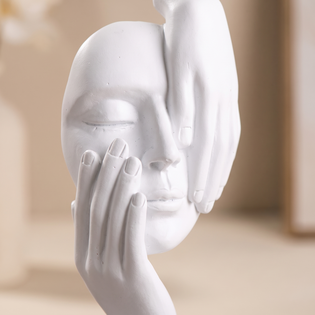 Close detail of the resin face sculpture's matte finish