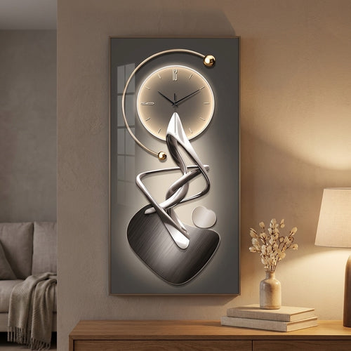 Portrait abstract wall clock with chrome ribbon art and gold-tone arc dial in a modern interior