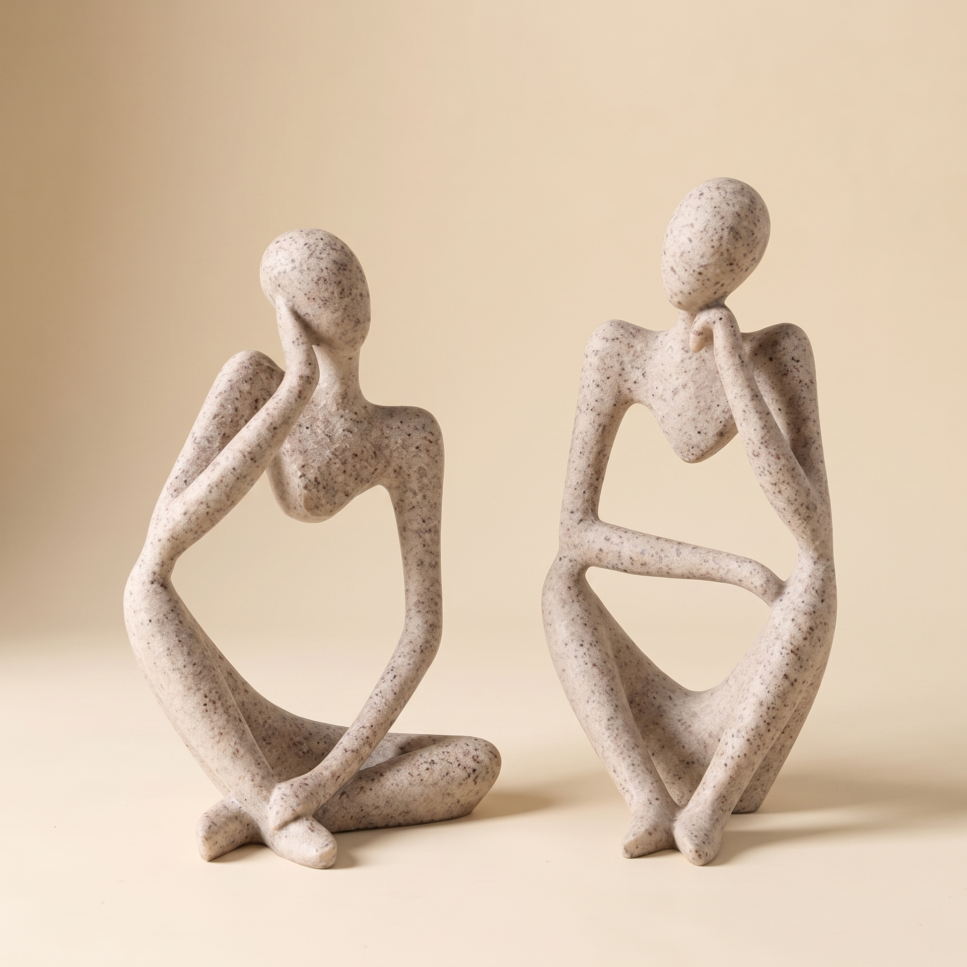 Sand-look resin Thinker sculpture on a styled desk corner