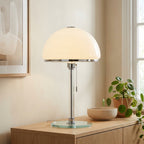Close-up of the opal-glass dome shade and polished chrome rim band of the Bauhaus table lamp