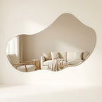 Frameless asymmetrical puddle wall mirror in clear silver glass
