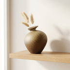 Sandstone stoneware bottle vase with dried pampas stems on a floating oak shelf