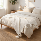 Brown tasseled knit throw casually draped over an armchair