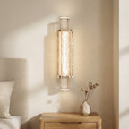 Bubbled glass column wall sconce with warm LED glow inside the center bar