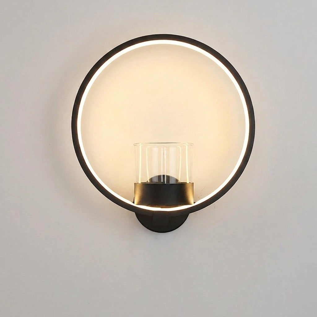 Round black ring wall lamp with its glass vessel shown empty — plants and greenery are not included