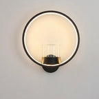 Round black ring wall lamp with its glass vessel shown empty — plants and greenery are not included