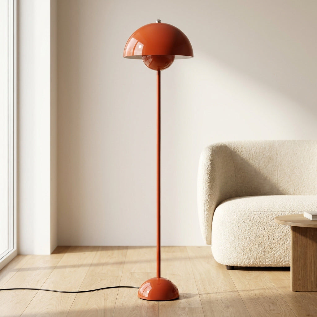 Mushroom-dome floor lamp beside a bed casting a soft warm glow