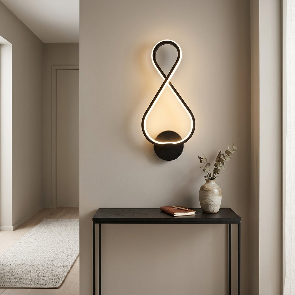 Nordic Figure-Eight LED Wall Sconce in black on a hallway wall