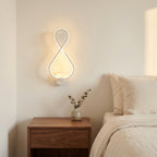 Nordic Figure-Eight LED Wall Sconce in white above a bedside nightstand