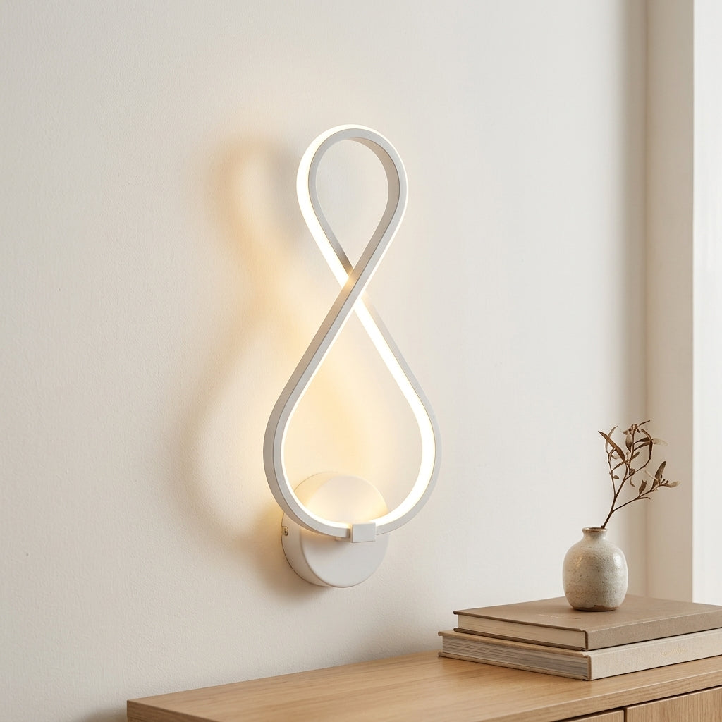 Nordic Figure-Eight LED Wall Sconce in white above a console shelf
