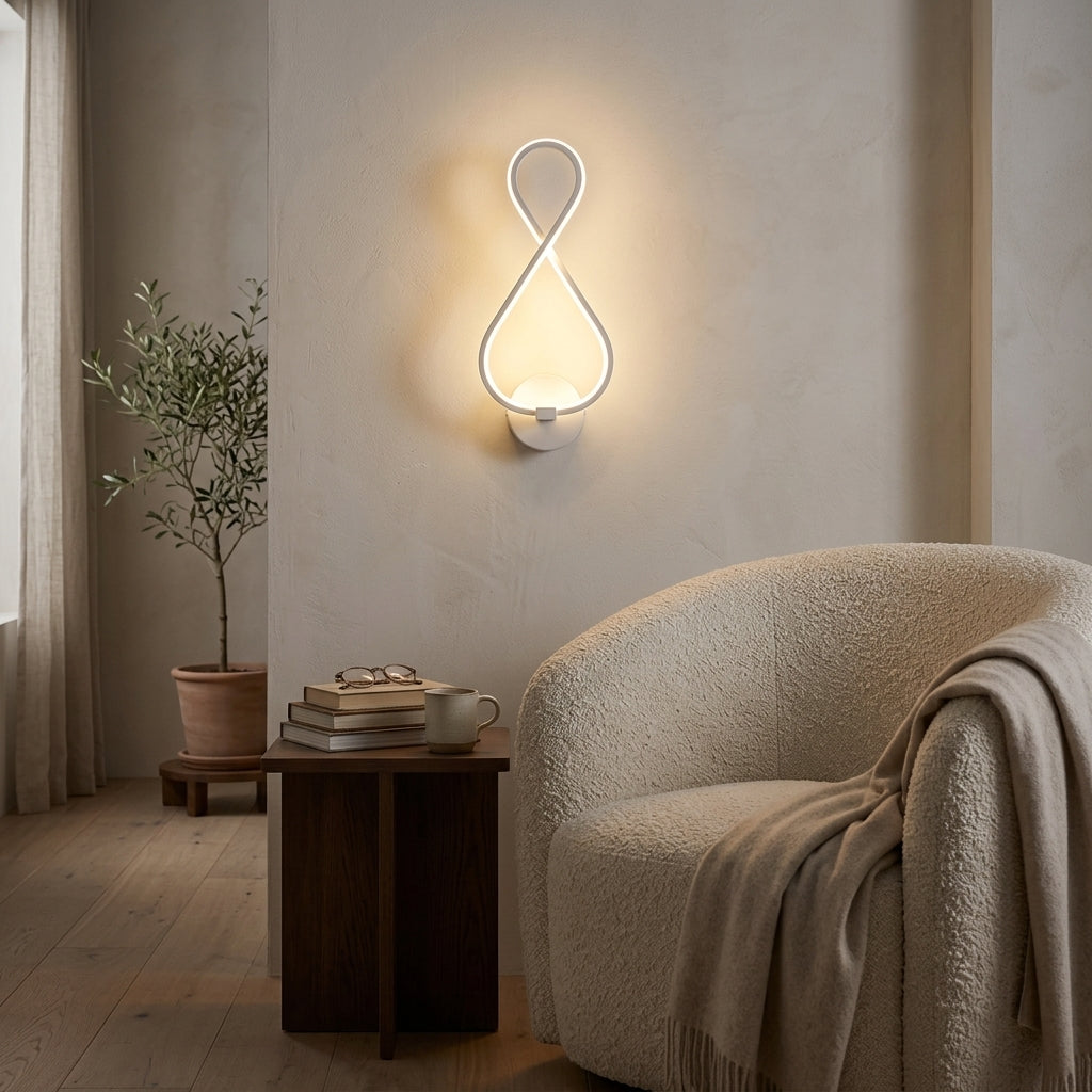 Nordic Figure-Eight LED Wall Sconce in white in a living-room reading corner