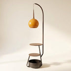 Arched floor lamp with side shelves styled in a living room corner