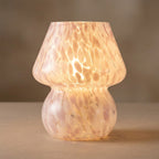 Pink and white speckled confetti glass mushroom table lamp glowing warmly