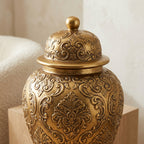 Detail of the domed lid knob finial on the antique-gold ginger jar