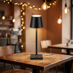 Cordless LED touch table lamp — in a cozy cafe corner ambient light