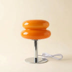 Pastel macaron glass table lamp — on warm cream studio backdrop