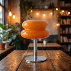 Pastel macaron glass table lamp — in a cozy cafe corner ambient light