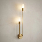Nordic luxe black-and-gold wall sconce — on textured plaster wall product shot