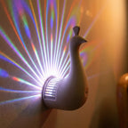 3D peacock wall sconce — material and form close-up