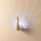 3D peacock wall sconce — on textured plaster wall product shot
