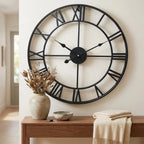3D Roman numeral metal wall clock — in modern entryway above console table