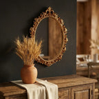 Gold oval vintage hanging wall mirror — above dining sideboard