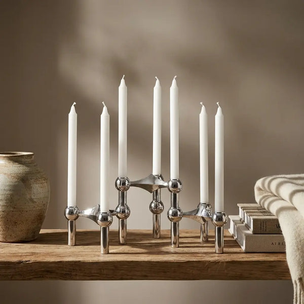 Molecular Structure Candelabra — styled on wooden shelf with books and throw