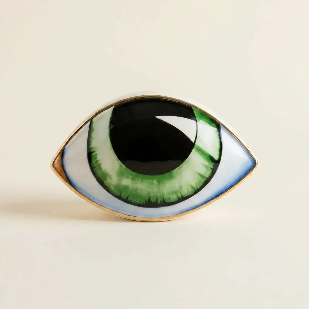 Nordic ceramic abstract evil-eye ornament sculpture — on warm cream studio backdrop