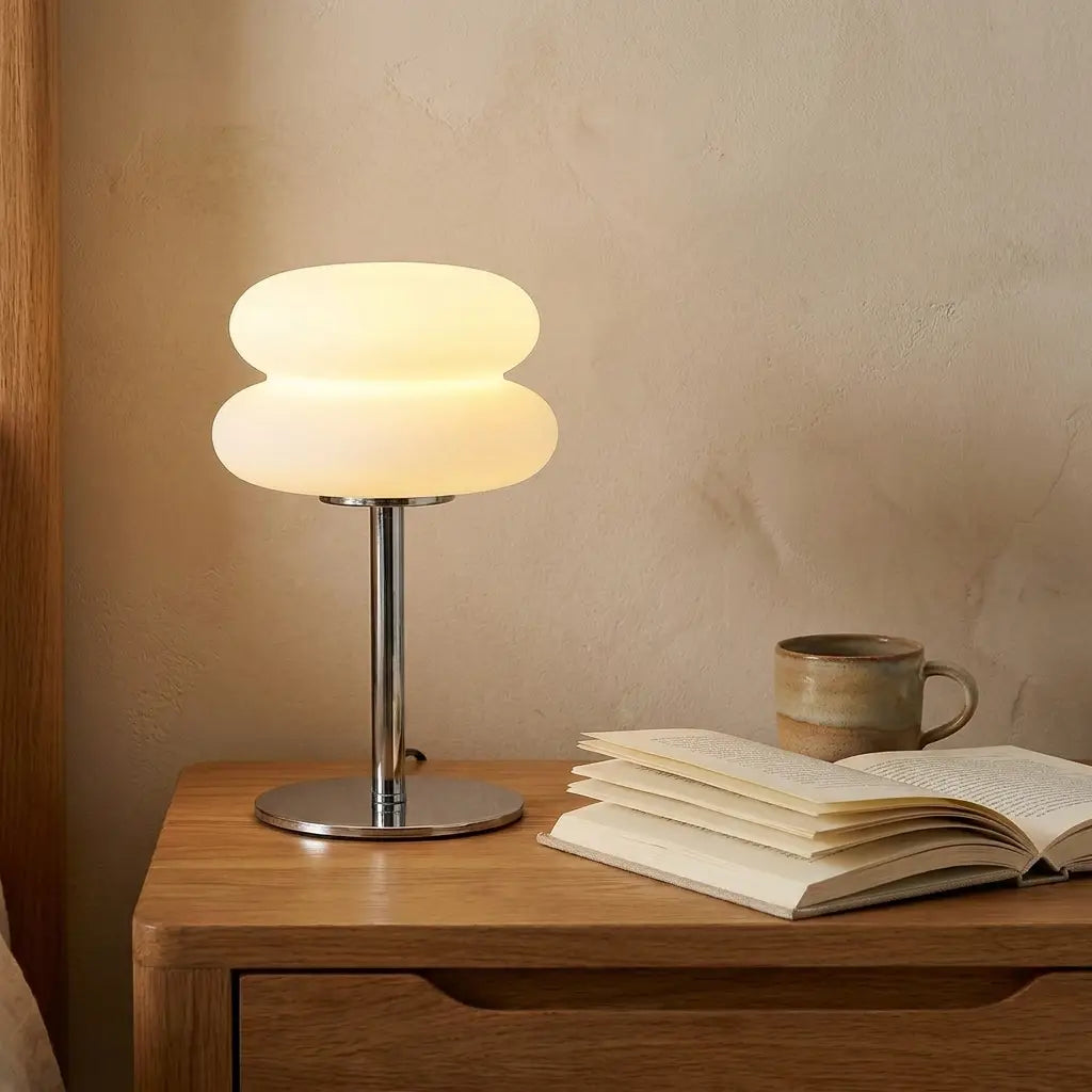 Cream-style bedside table lamp — on solid oak nightstand
