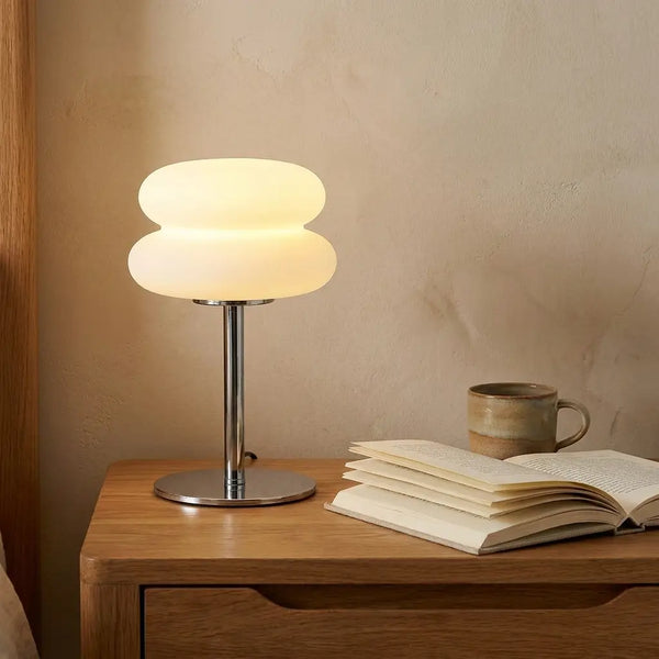 Cream-style bedside table lamp — on solid oak nightstand