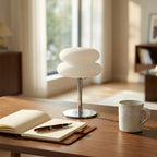 Cream-style bedside table lamp — on minimal walnut desk