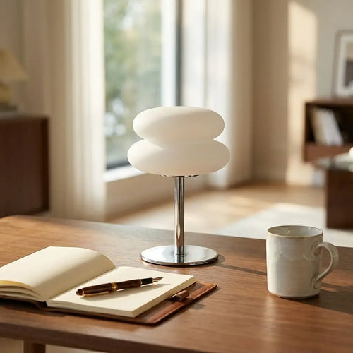 Cream-style bedside table lamp — on minimal walnut desk