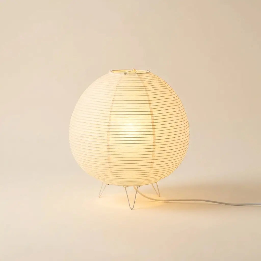 Japanese andon paper lantern table lamp — on warm cream studio backdrop