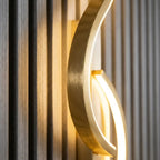 Long strip LED wall sconce — in modern entryway hallway