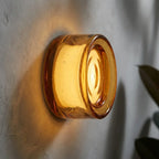 Round opal glass wall sconce — material and form close-up