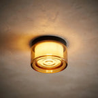 Round opal glass wall sconce — dramatic low-angle hero shot