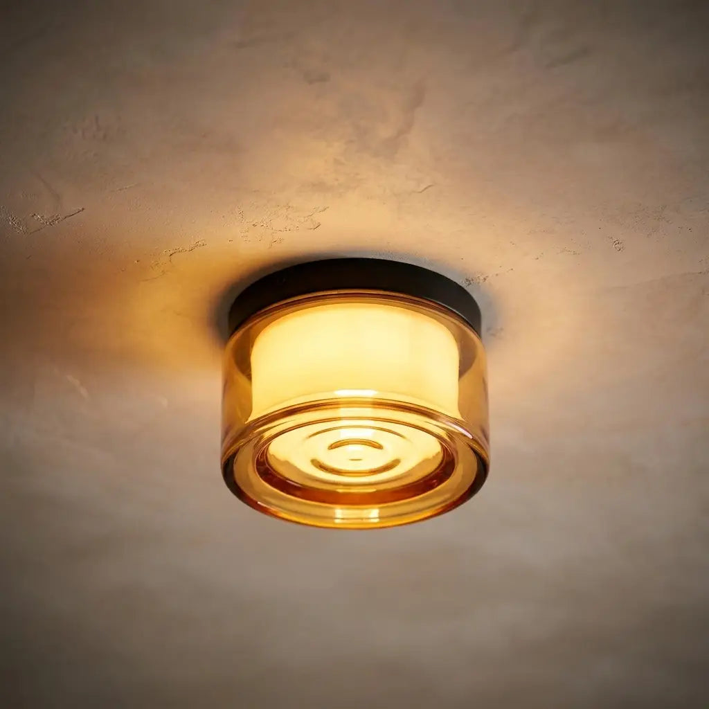 Round opal glass wall sconce — dramatic low-angle hero shot