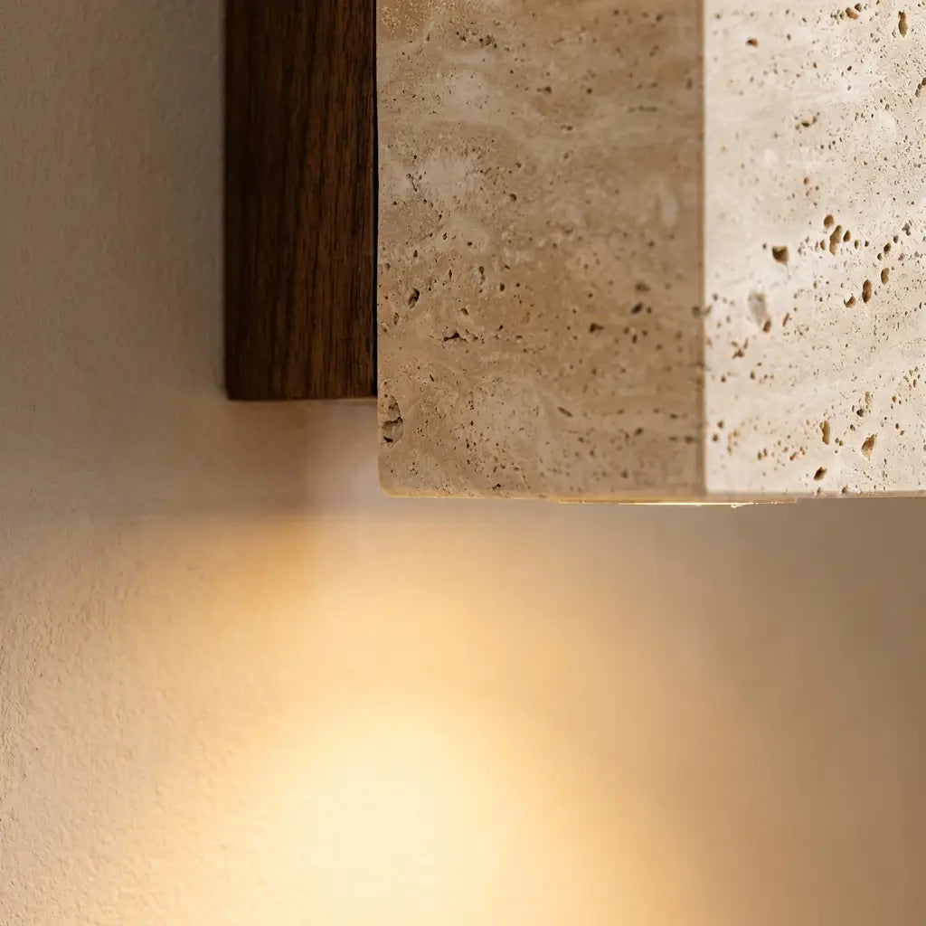 Wabi-Sabi travertine wall lamp — material and form close-up