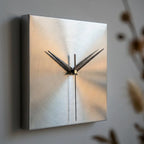 Stainless steel wall clock — material and form close-up