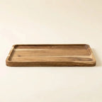 Natural acacia wood rectangular tray — on warm cream studio backdrop