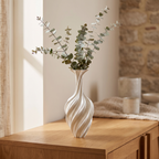 White metal swirl vase on a dining sideboard