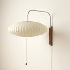 Flying-saucer pleated silk-effect wall lamp with chrome-tone arm and walnut wood bracket