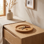 Bamboo saucer catching keys and a ring on an entryway console