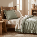 Sage green woven cushion cover with frill edge on a bed