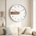 Modern Nordic wall clock, white rim with walnut accent and full numerals, rose-gold hands, in a bright living room