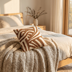 Stack of woven knit cushion covers in warm neutral tones